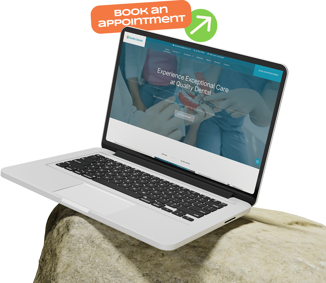 Open laptop displaying the homepage of Quality Dental's website with a "Book an Appointment" button, promoting exceptional dental care and services online.